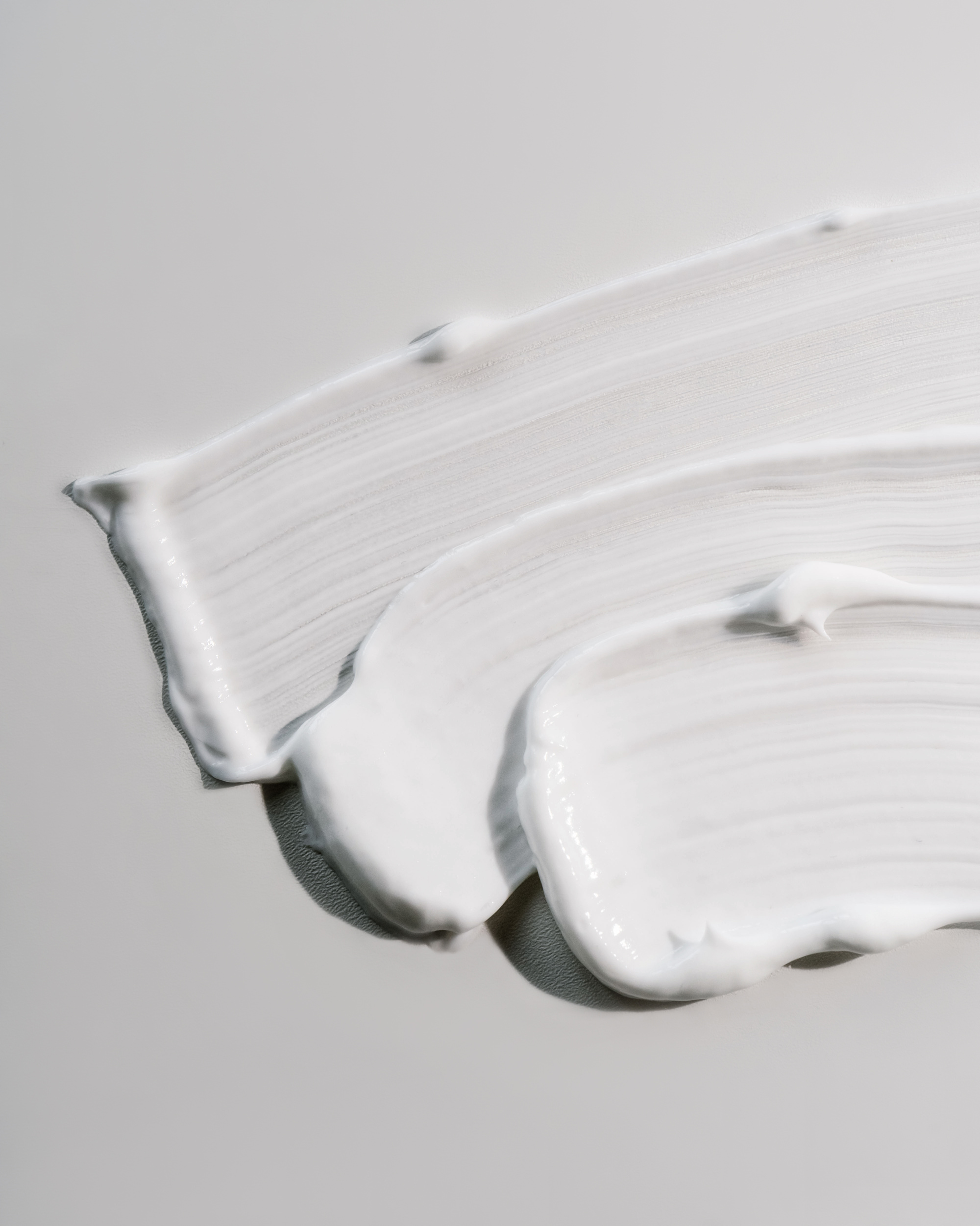White Cream Texture on a White Background.